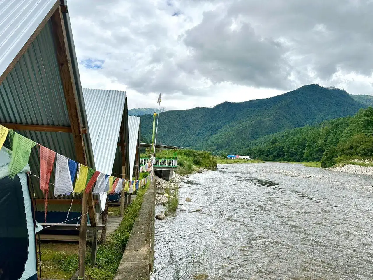 Side view of riverside tents at Sangti Tsomka Campsite Dirang